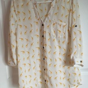 A white sheer button up blouse